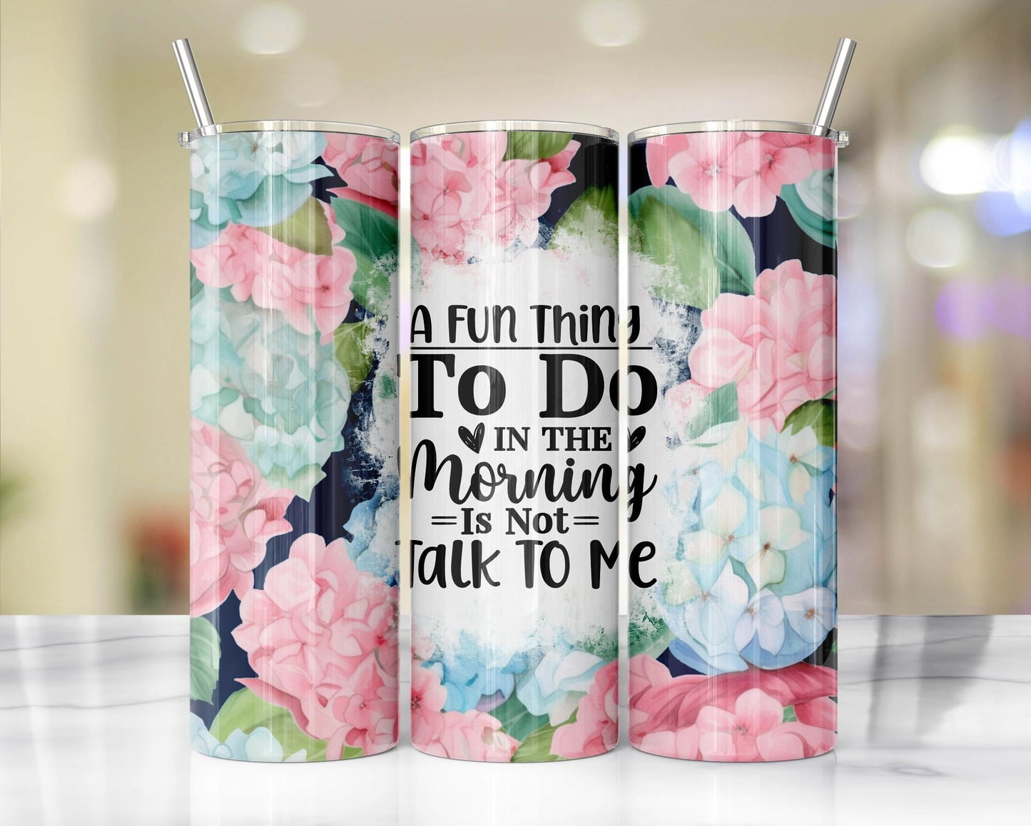 Beautiful blue and pink hydrangea floral 20 oz stainless steel tumbler with the words, A fun thing to do in the morning is not talk to me.